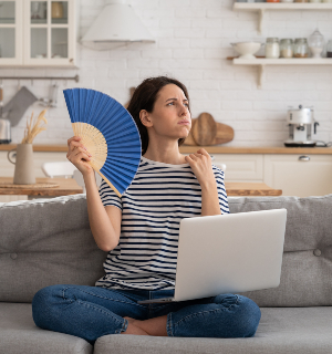 Tired millennial woman suffering from heatstroke flat without air-conditioner, waving blue fan, sitting on couch at home, working on laptop computer. Overheating, high temperature, hot summer weather. SSUCv3H4sIAAAAAAAAA31Py26DMBD8lz2DBDiEwHf0FvXgV4iFsSN73Sog/r1roFJP3dPMjmZndgWjYADB2lvfNFV5q7pLWddalPxx7cqLYrzSTMhedFCA4qhhqFlzrfqmbruGtayiKUDwaCQMKxhrU8TA0XgHAylBO6XDDrUy6IPhlthWQESOKepINmKSbo+k7vz33n3NeypI4TGJDLbiv92Hlk/nrR/ff9TPAvionXznpC1XsprvwXeYrJpniV+9J8Nkl7TYzi4PIM/0jTrMZz2Pz/xFhq9gpHHjWZu+9fOBncd8dC+GXk5Gnebj06ehbcglIL2s50qrU05iNogH3bYfkC4x/5QBAAA=
